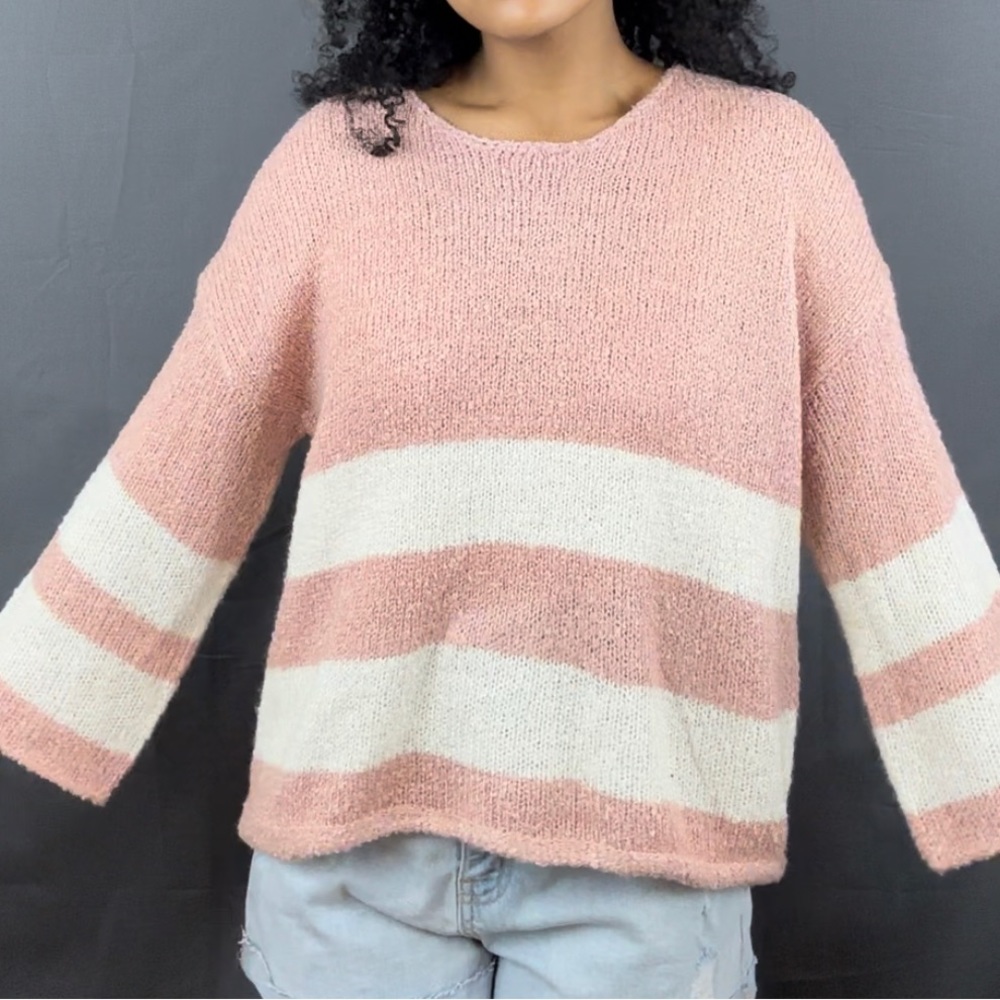 Cute pink sweater in size large.